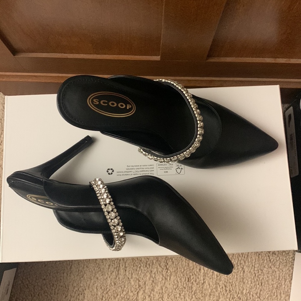 Black pointy toe heels with rhinestone strap